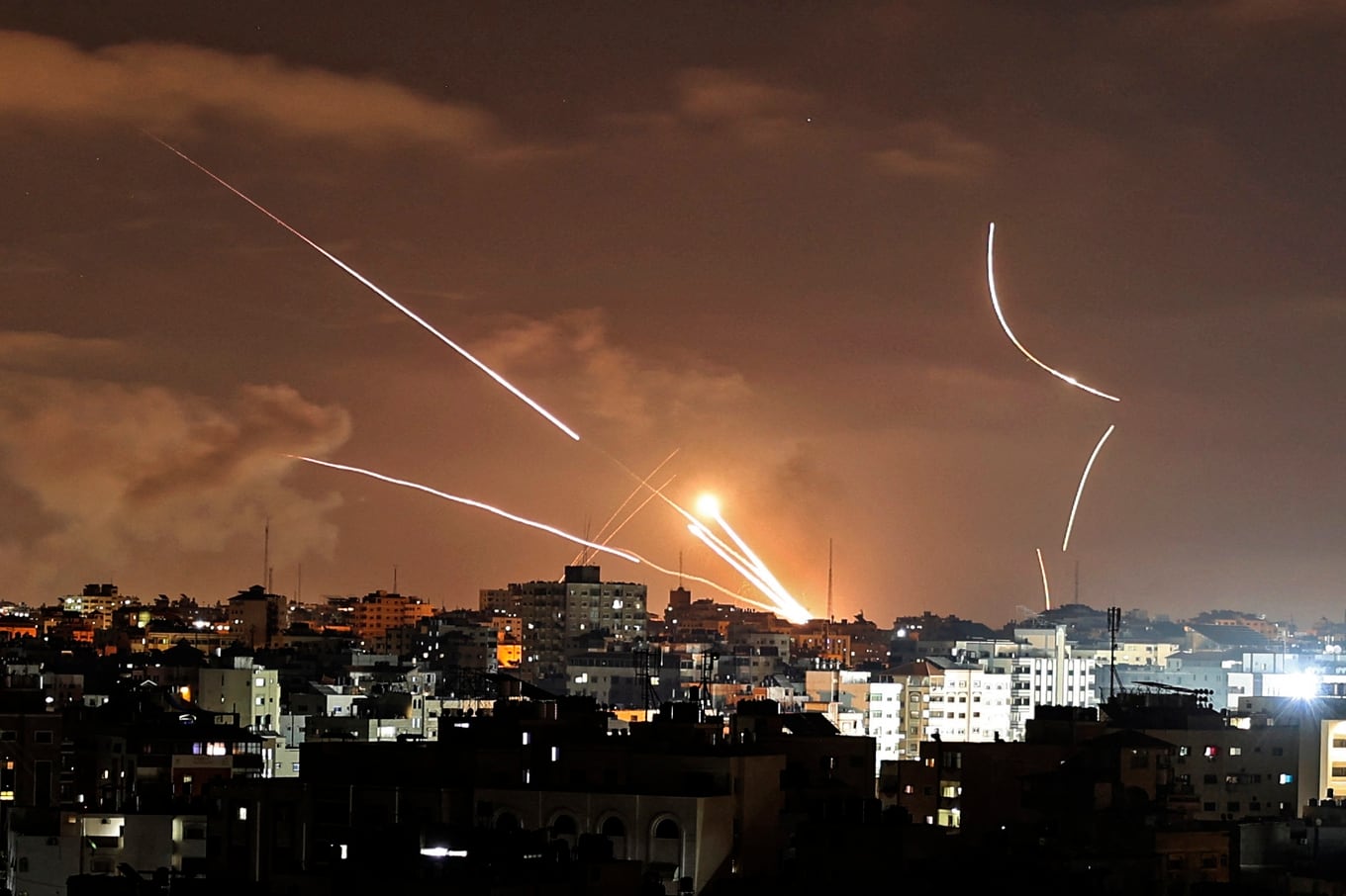 Rockets are launched from Gaza City, controlled by the Palestinian Hamas movement, towards Israel on May 12, 2021, amid the most intense Israeli-Palestinian hostilities in seven years. (Photo by MAHMUD HAMS / AFP)