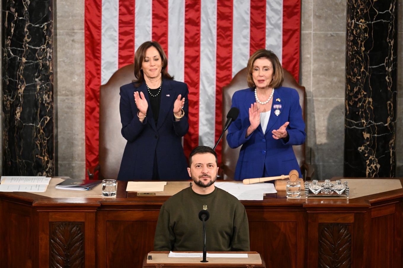 (FILES) In this file photo taken on December 22, 2022 Ukraine's President Volodymyr Zelensky addresses the US Congress as US Vice President Kamala Harris (L) and US House Speaker Nancy Pelosi (D-CA) applaud at the US Capitol in Washington, DC. (Photo by Jim WATSON / AFP)