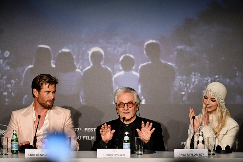 Australian director and screenwriter George Miller (C) speaks flanked by Australian actor Chris Hemsworth (L) and British-US actress Anya Taylor-Joy as they give a press conference for the film “Furiosa: A Mad Max Saga” during the 77th edition of the Cannes Film Festival in Cannes, southern France, on May 16, 2024. (Photo by Julie SEBADELHA / AFP)
