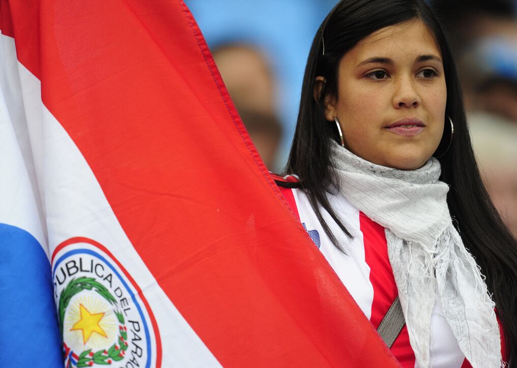 A supporter of Paraguay's football squad awaits the start of the 2010 World Cup round of 16 match Paraguay versus Japan on June 29, 2010 at Loftus Versfeld Stadium in Tshwane/Pretoria. NO PUSH TO MOBILE / MOBILE USE SOLELY WITHIN EDITORIAL ARTICLE -             AFP PHOTO / JOHN MACDOUGALL