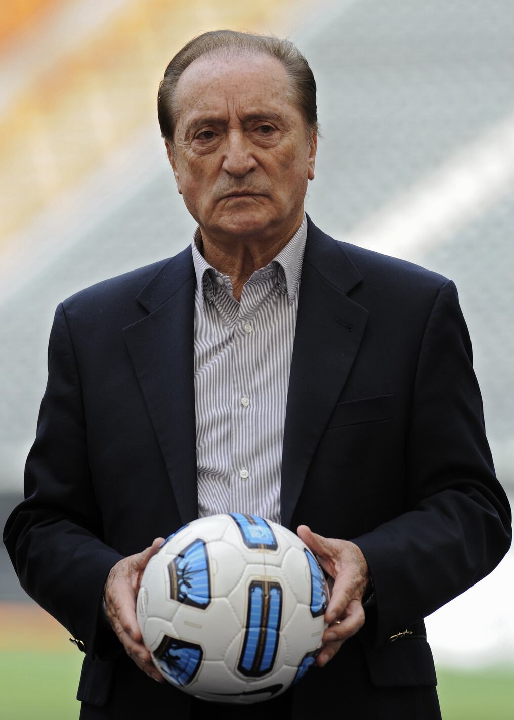 (FILE) South American Football Confederation (CONMEBOL) vice president Eugenio Figueredo holds a "T90 Tracer Doma", the official football for the Copa America 2011, during its presentation at Ciudad de La Plata stadium in La Plata, some 62 Km south of Buenos Aires, on April 15, 2011. Switzerland will extradite former FIFA vice president Eugenio Figueredo to his native Uruguay instead of the United States after his arrest in the corruption scandal rocking world football, a judge said ON December 18, 2015. AFP PHOTO / Juan Mabromata / AFP / JUAN MABROMATA