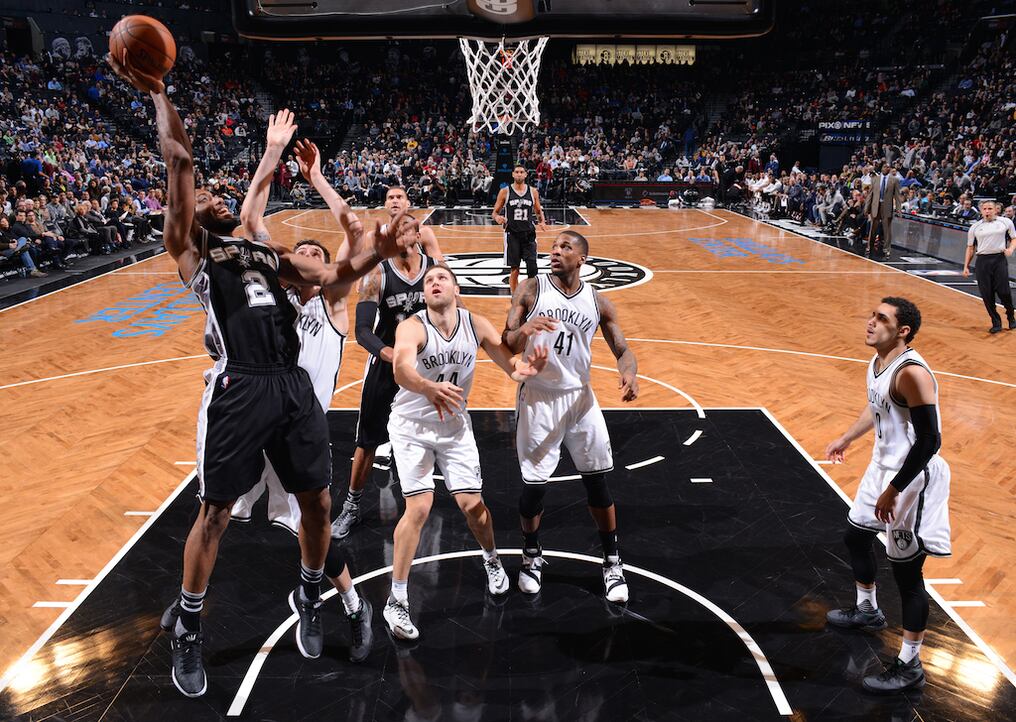 BROOKLYN, NY - JANUARY 11: Kawhi Leonard #2 of the San Antonio Spurs goes up for the layup against the Brooklyn Nets on January 11, 2015 at Barclays Center in Brooklyn, New York. NOTE TO USER: User expressly acknowledges and agrees that, by downloading and or using this Photograph, user is consenting to the terms and conditions of the Getty Images License Agreement. Mandatory Copyright Notice: Copyright 2016 NBAE   Jesse D. Garrabrant/NBAE via Getty Images/AFP