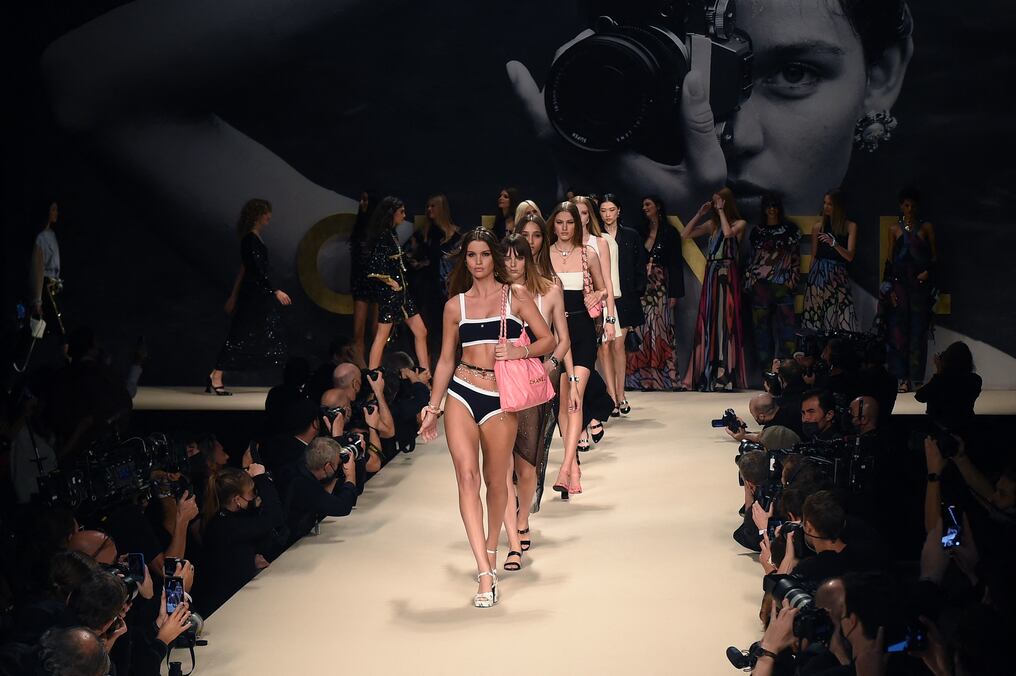 Models present creations by Chanel during the Women's Spring-Summer 2022 Ready-to-Wear collection fashion show as part of Paris Fashion Week in Paris, on October 5, 2021. (Photo by Lucas BARIOULET / AFP)