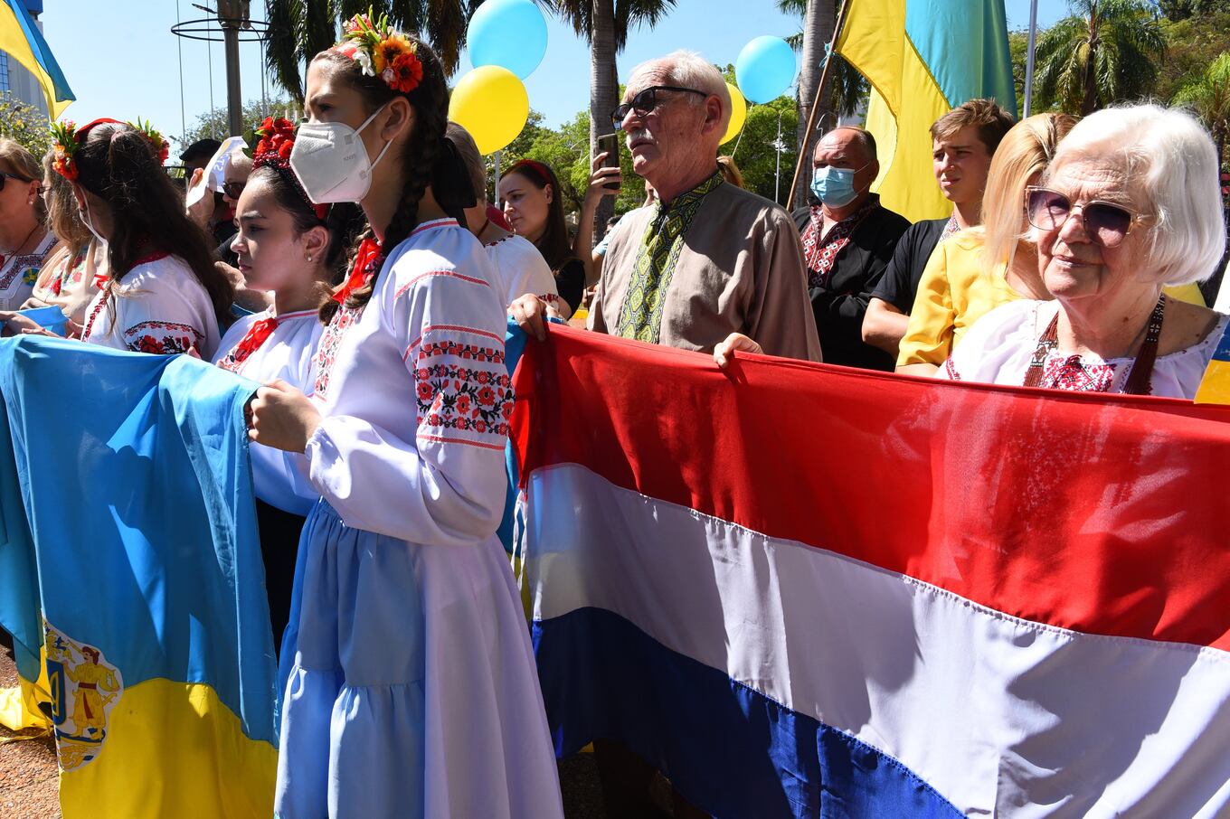 Members of the Ukrainian collectivity participate in a protest against the war and in support of Ukraine at the Plaza de Armas in Encarnacion, Paraguay, on February 26, 2022. - Russian President Vladimir Putin launched a full-scale invasion of Ukraine on Thursday, unleashing air strikes and ordering ground troops across the border in fighting that Ukrainian authorities said left dozens of people dead. (Photo by NORBERTO DUARTE / AFP)